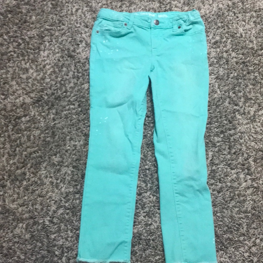Teal-ish jeans with paint splatters